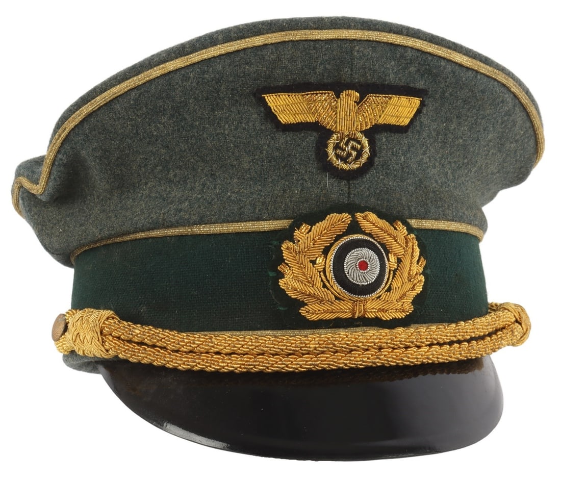 WWII GERMAN THIRD REICH HEER GENERAL VISOR: A visor for a general of the Wehrmacht of the German Third Reich. Field gray cloth with black velvet band. Reichsadler and cockade badges on front. Gold bullion strap. Tight and aligned back seam. Har