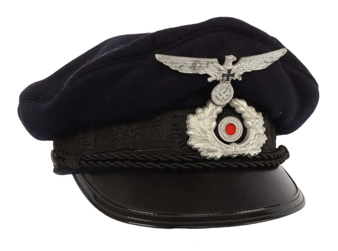 WWII GERMAN KYFFHAUSER BUND VISOR CAP: Kyffhauser Bund visor cap of blue wool with embroidered band, chin cord and black leather visor. Interior has grey leather sweatband, blue rayon liner and celluloid sweat diamond. Sweatband marked "28