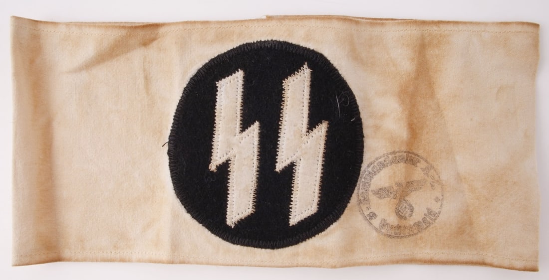 WWII GERMAN SS CONCENTRATION CAMP DOCTOR ARMBAND: A white doctor's armband bearing the SS-Siegrunes.