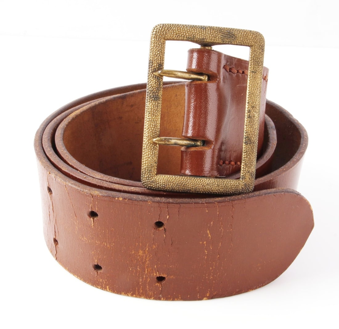 NSDAP POLITICAL LEADER BELT WITH OPEN CLAW BUCKLE: Brown leather belt with pebbled brass open claw buckle. Buckle marked "RZM M5/140." Belt marked "Kernstuck RZM L2/1081/41" and "90." Overall length 41.5 inches.