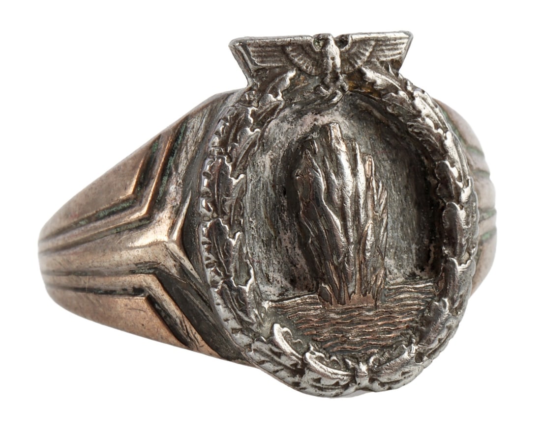 KRIEGSMARINE WAR BADGE HALLMARKED SILVER RING: Silver ring with miniature Kriegsmarine Minesweeper War Badge, ca. 1941. Exterior stamped with Dutch silver hallmark, a single sword, indicating minimum .833 fineness. Size 8. Gross weight 5.8 grams.