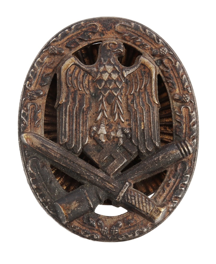 WWII GERMAN GENERAL ASSAULT BADGE IN SILVER: Heer eagle insignia atop crossing bayonet and grenade. Screwback plate. It measures 2 1/8 inches. Weighs 48.9 grams. This lot has a reserve.