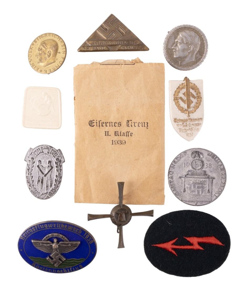 WWII GERMAN REICH COLLECTION OF TINNIES LOT OF 10: A collection of ten small items from the German Third Reich. Six tinnies, two plastic badges, one metal badge, and a patch.