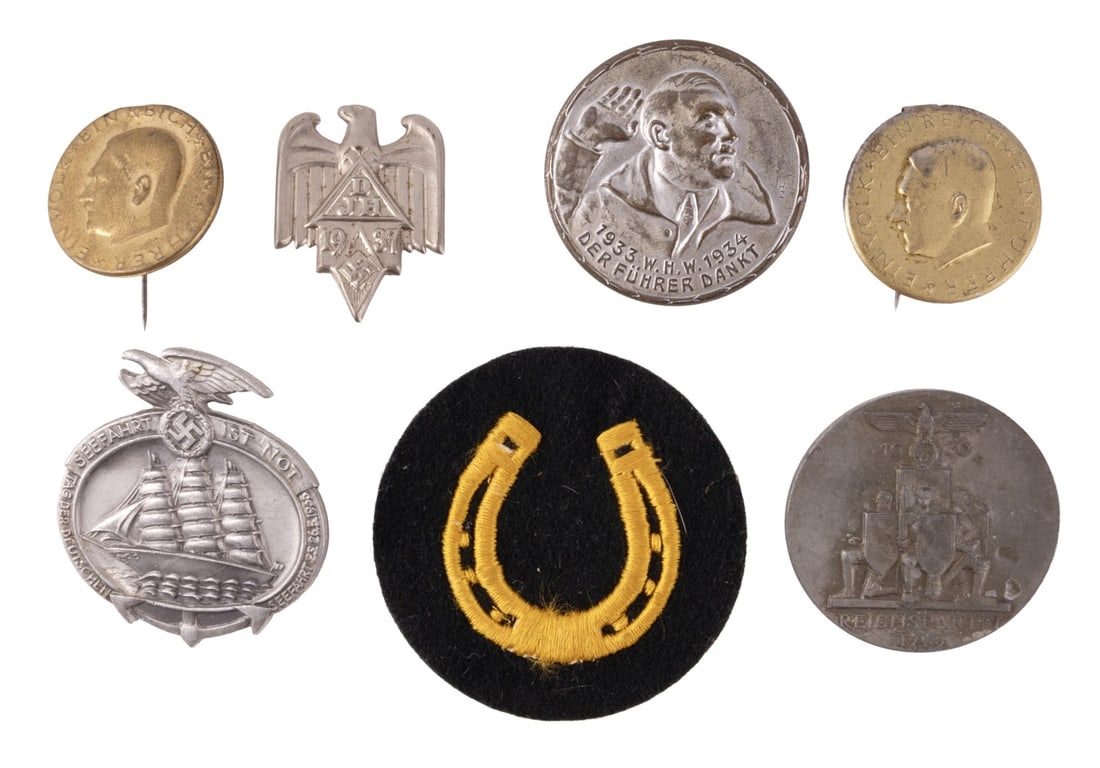 WWII GERMAN REICH COLLECTION OF TINNIES LOT OF 7: A collection of eight small items from the German Third Reich. Six tinnies and one patch.