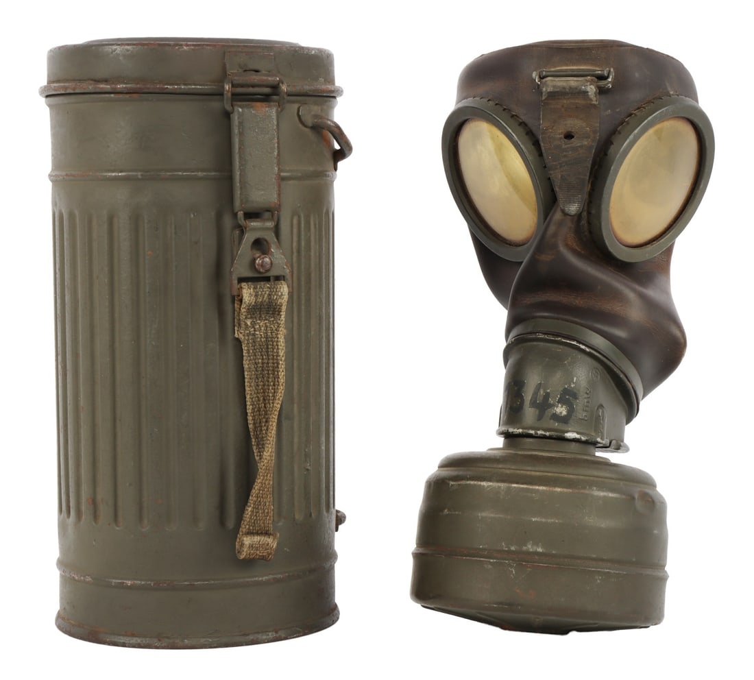 WWII GERMAN M38 GAS MASK WITH FILTER & CANISTER: German M38 gas mask with filter cartridge and storage canister. Filter has Waffenamt stamp. Also includes packet with replacement lens.