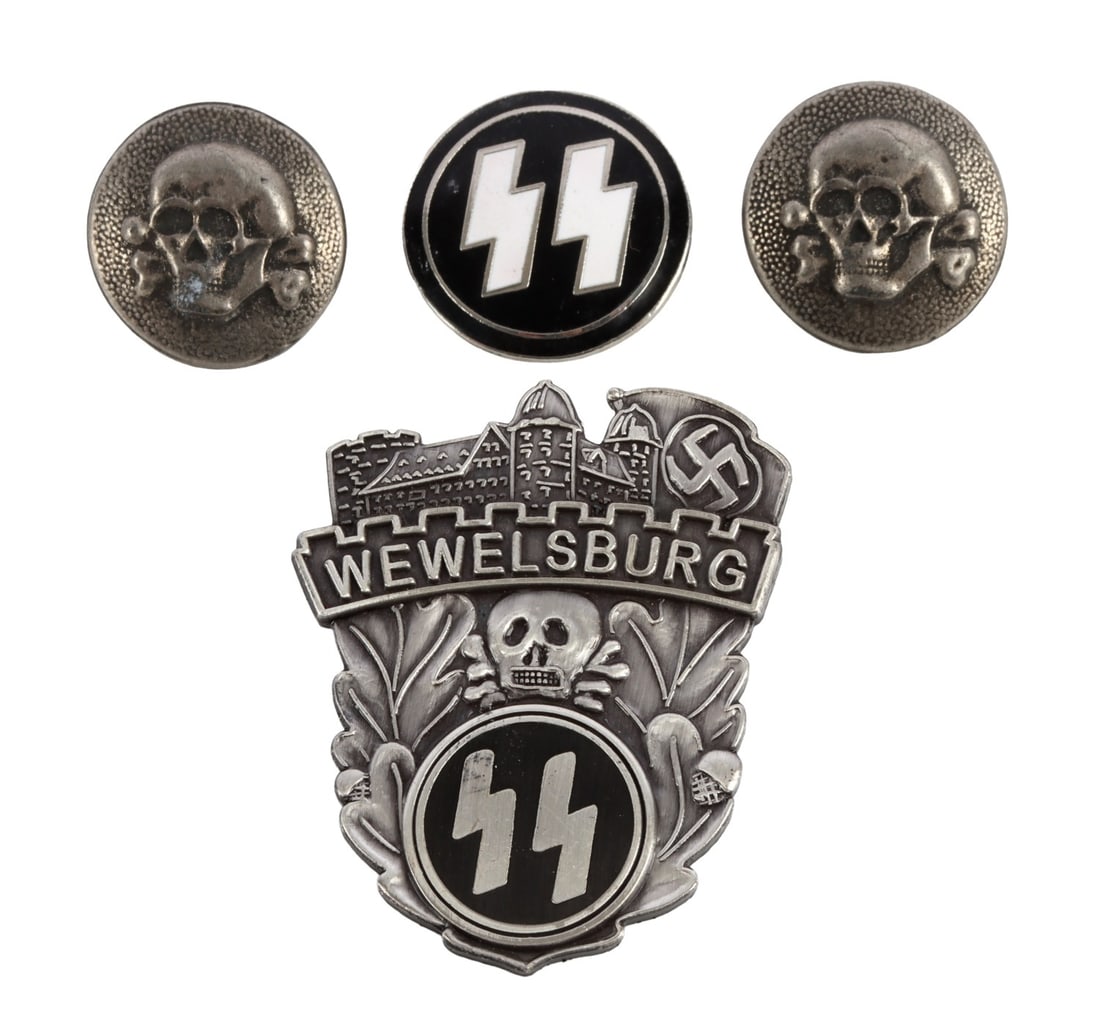 WWII GERMAN THIRD REICH COLLECTION OF ITEMS LOT 4: Four items bearing the symbols of the SS of the German Third Reich. 1) Enamel pin with SS-Siegrunes. RZM M1/122. 2) Wewelsburg pin badge. 3) SS Totenkopf button. 4) SS Totenkopf button.