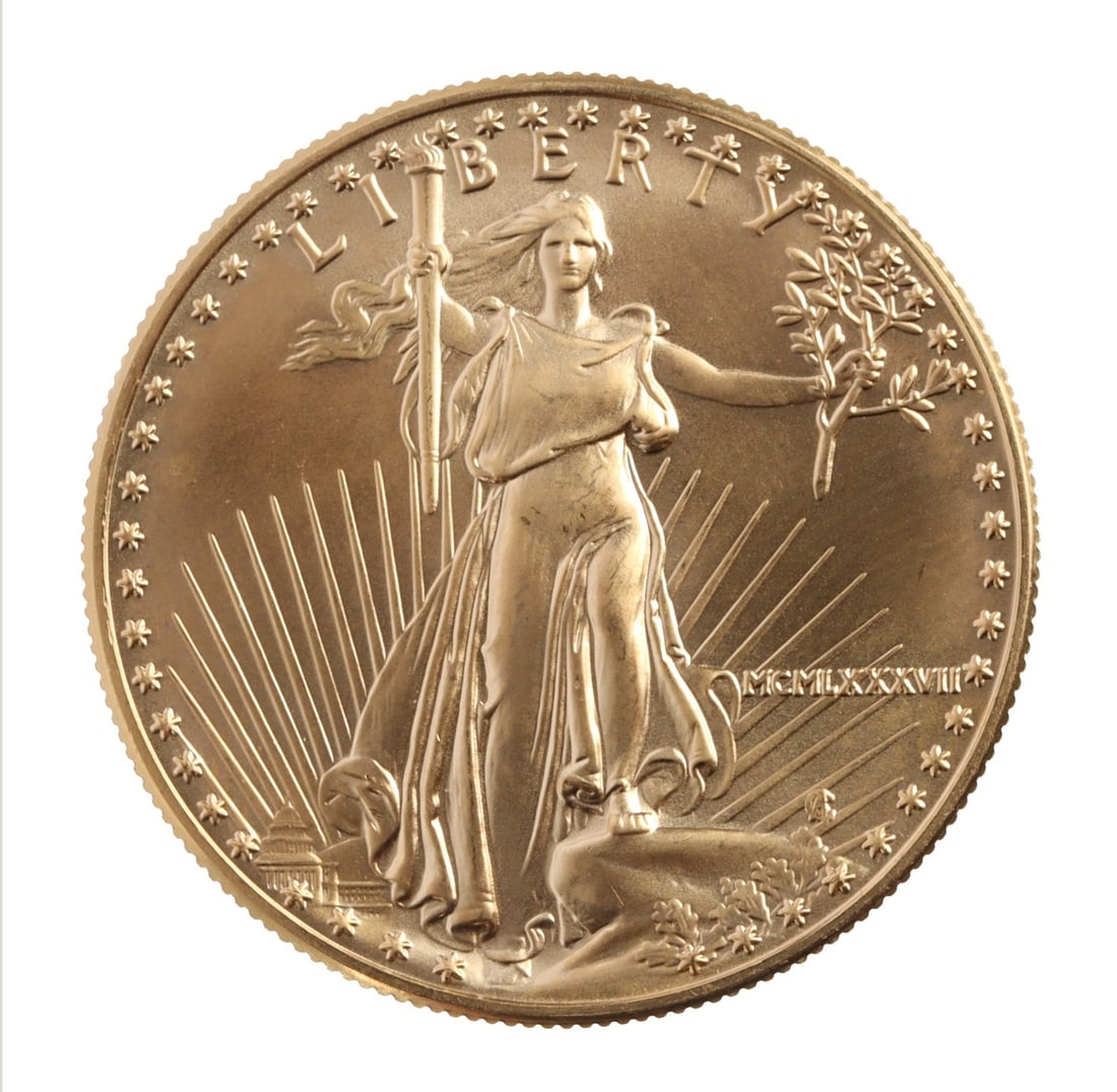 1987 ONE OUNCE GOLD AMERICAN EAGLE: 1987 date. Brilliant uncirculated. This lot has a reserve.