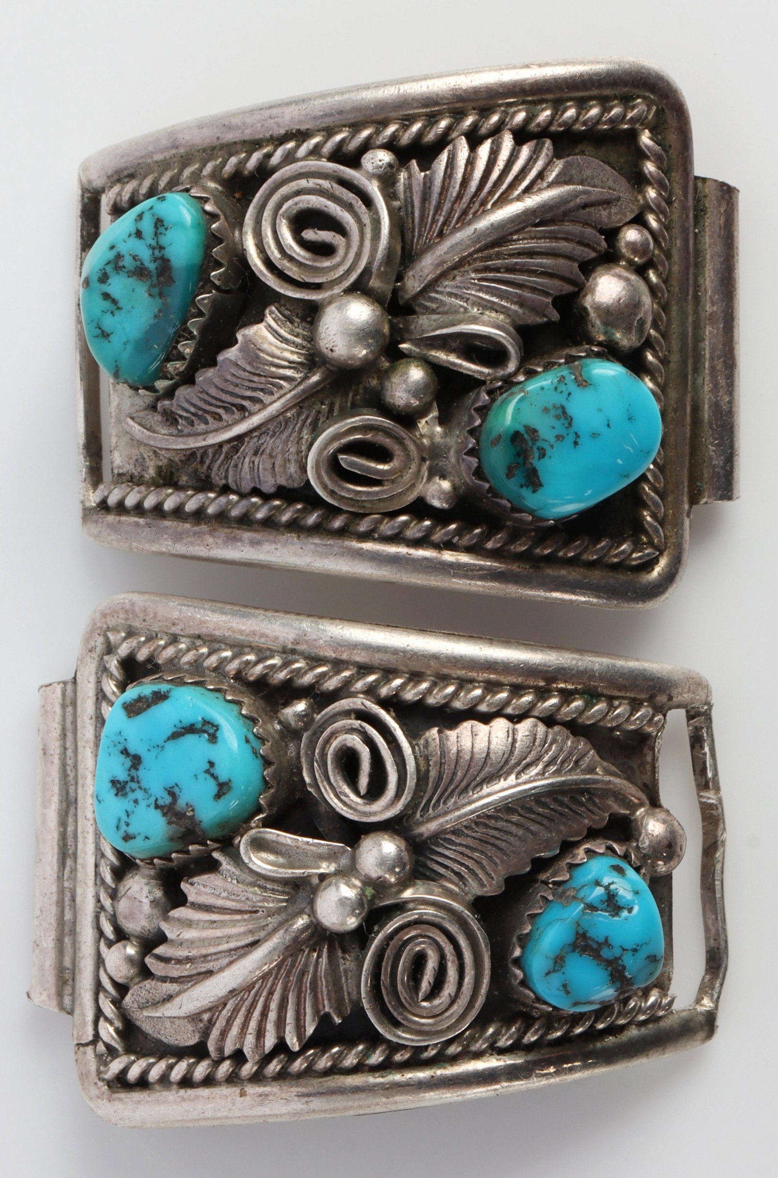 NAVAJO STERLING SILVER TURQUOISE WATCH BAND SIGNED: Navajo watch band signed "ub," possibly "u5." Band is made of sterling silver with a total of 4 pieces of turquoise. Measures 1.46x1.11x0.33 inches. Turquoise characteristic of stones from San Bernard