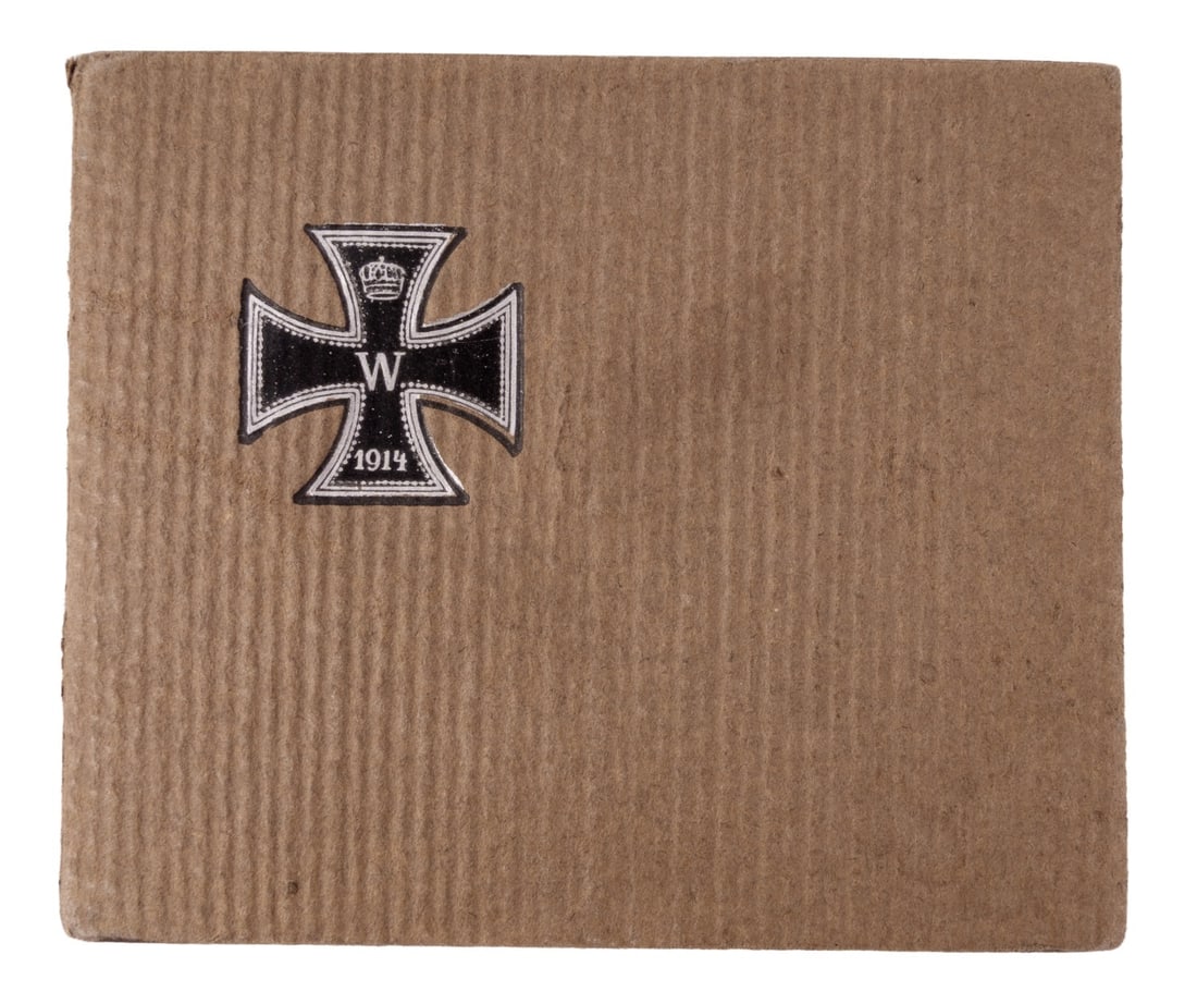 WWI IMPERIAL GERMAN PHOTO ALBUM IRON CROSS: A photo album from the First World War, with an Iron Cross on the front cover. Among the depictions in the album are cities, life on the front, and more domestic scenes. Photo album not completed.