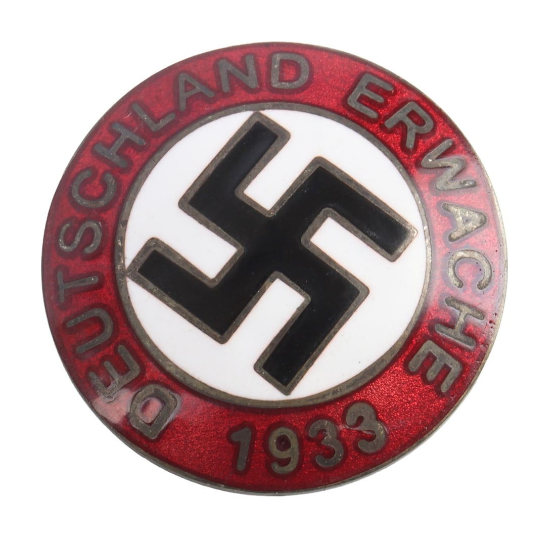 WWII GERMAN THIRD REICH DEUTSCHLAND ERWACHE BADGE: An NSDAP swastika badge bearing the phrase, "Deutschland Erwache" (Deutschland Forever). RZM stamped, M/129.