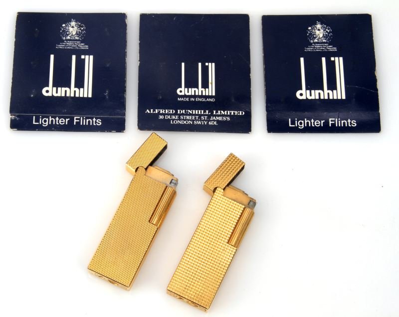 2 DUNHILL JAPAN ROLLER GAS LIGHTER LOT W FLINTS: Very good condition two diamond pattern gold plate lighters, also three unopened flint packs.