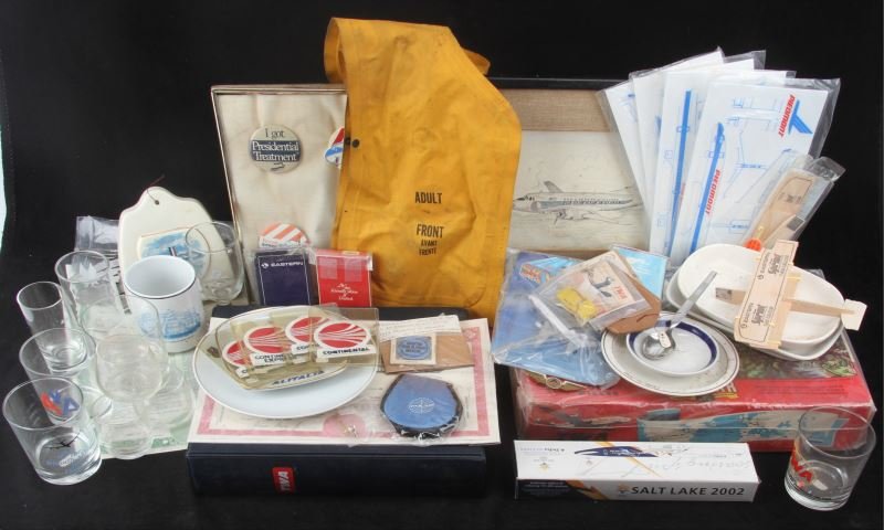 VINTAGE AIRLINE BADGES DONT DISTURB SIGN LOT: American Airlines Reserved Seat Sign, Replica of a Boeing 757-200 airplane, Eastern and United Airlines playing cards, pin-back buttons, inflatable life vest and Pan-American World Airway Certificate,