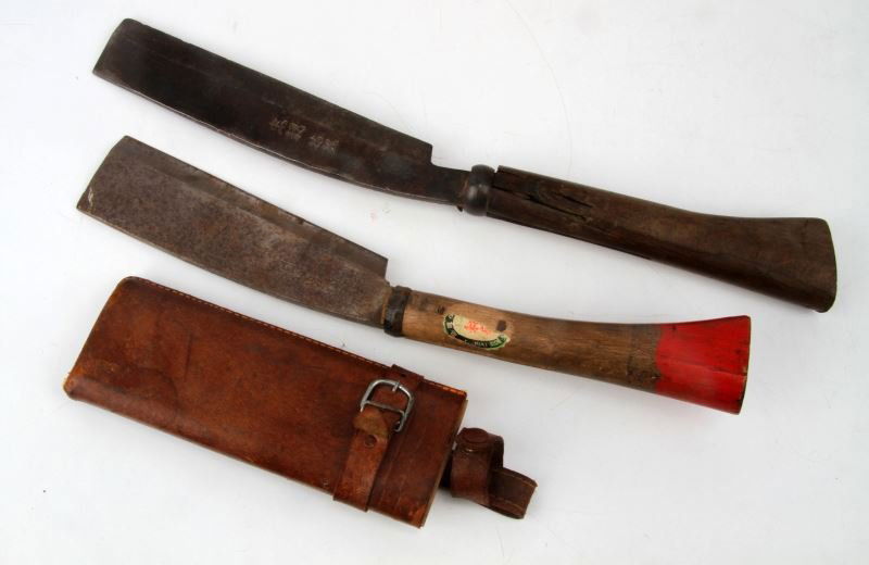 TWO JAPANESE WWII-ERA MACHETES: Machetes measure approximately 14 inches and 16 inches. Machetes have writing on the blade. Some rust and oxidation on blades; otherwise in good condition.