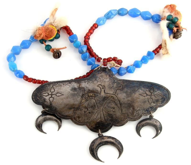 PLAINS INDIAN SILVER ENGRAVED TRADE GORGET: Late 19th century to early 20th century silver engraved 8 by 4.5 inch with hanging crescents, unpolished patina, well-crafted, re-strung period trade beads, with medicine bundle adornments these appea