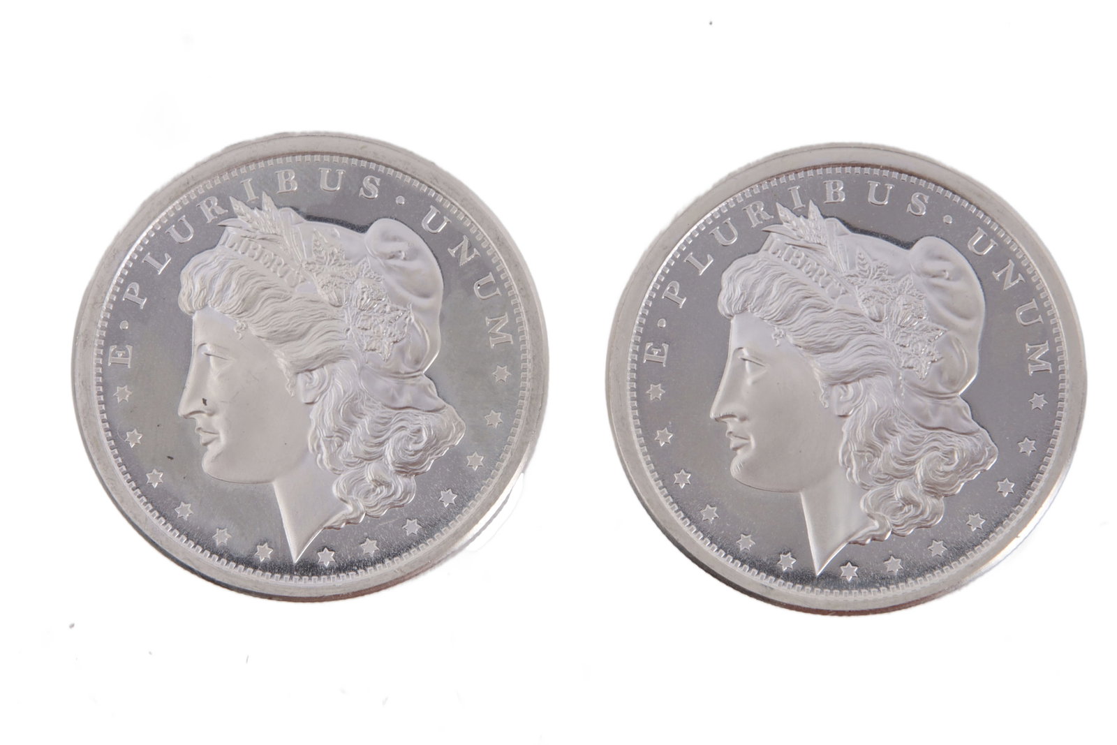 Two 1 Troy Ounce .999 Silver Morgan Rounds: Morgan silver dollar design. This lot has a reserve.