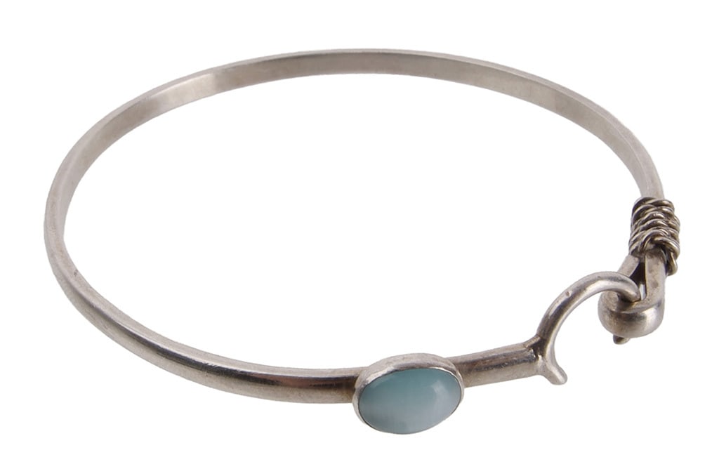 Caribbean Hook Bracelet Blue Cat's Eye Sterling: Stamped 925 inside bracelet. Also known as Crucian bracelet, it symbolizes love and connection with the sea. Direction of hook also indicates the wearer's relationship status (inward for taken,