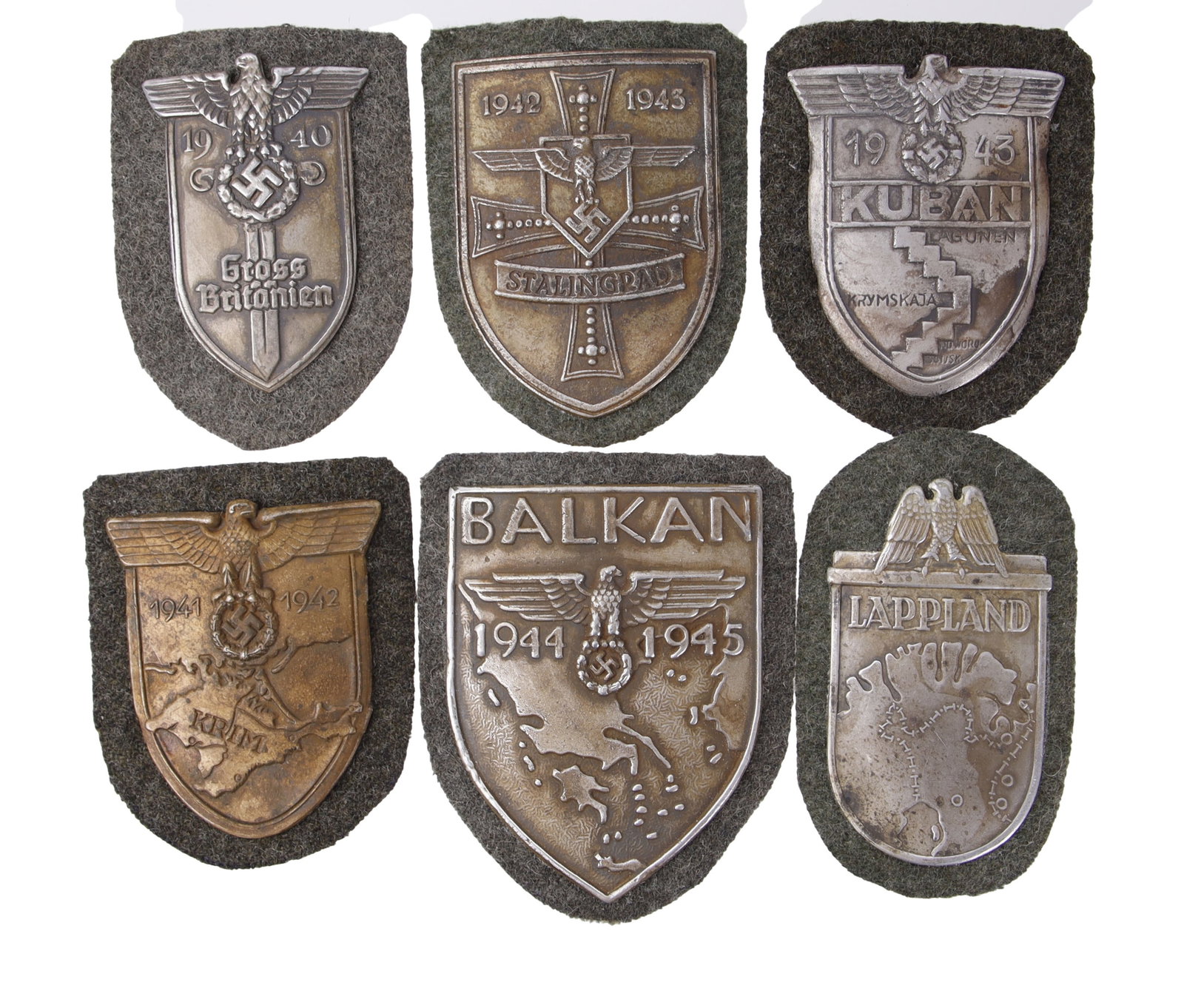 Campaign Badges Lot of 6 WWII German Reich: Six (6) campaign shields: Lappland, Balkans, Krim, Stalingrad, Gross Britanien, and Kuban.