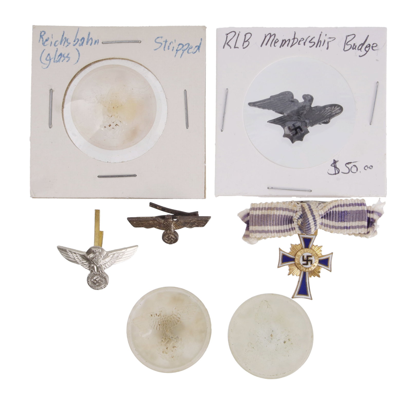 WWII German Insignia & Glass Button Lot of 7 Pcs: Lot of seven (7) pieces. Includes three Reichsbahn glass buttons, RLB Membership Badge, Mother's Cross of Honour pin and two visor eagle pins.