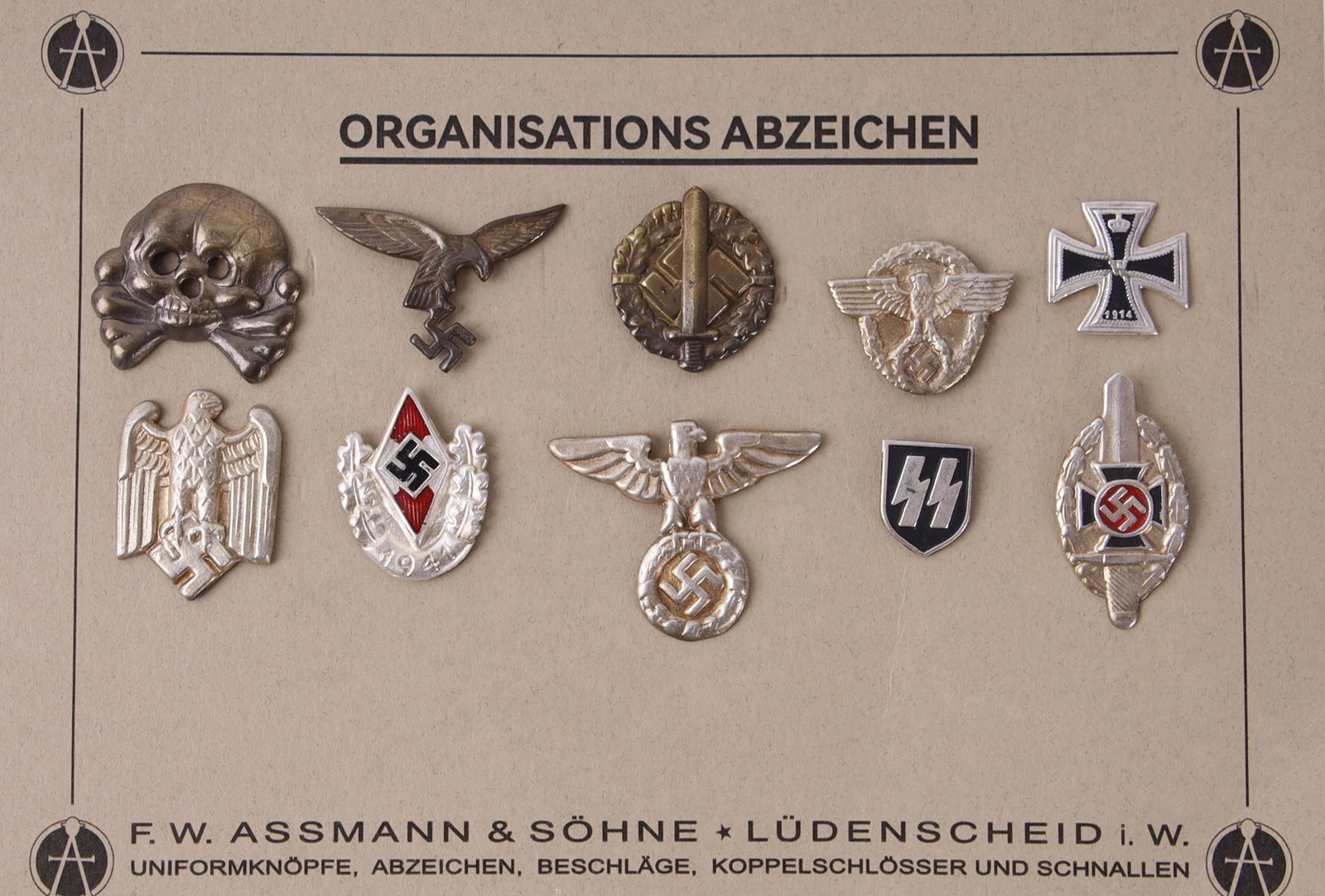 WWII German Reich Organization Lapel Pins: Ten lapel pins for various organizations within the Third Reich, arranged on an Assmann & Sohne manufacturing card.