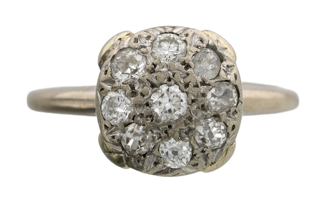 Art Deco 14K Gold Shield Ring With Diamonds: An art deco shield ring with nine earth-mined diamonds in white gold. Early twentieth century, likely New York or Germany in origin. Maker's mark is unidentified, but is a crescent moon with a k.