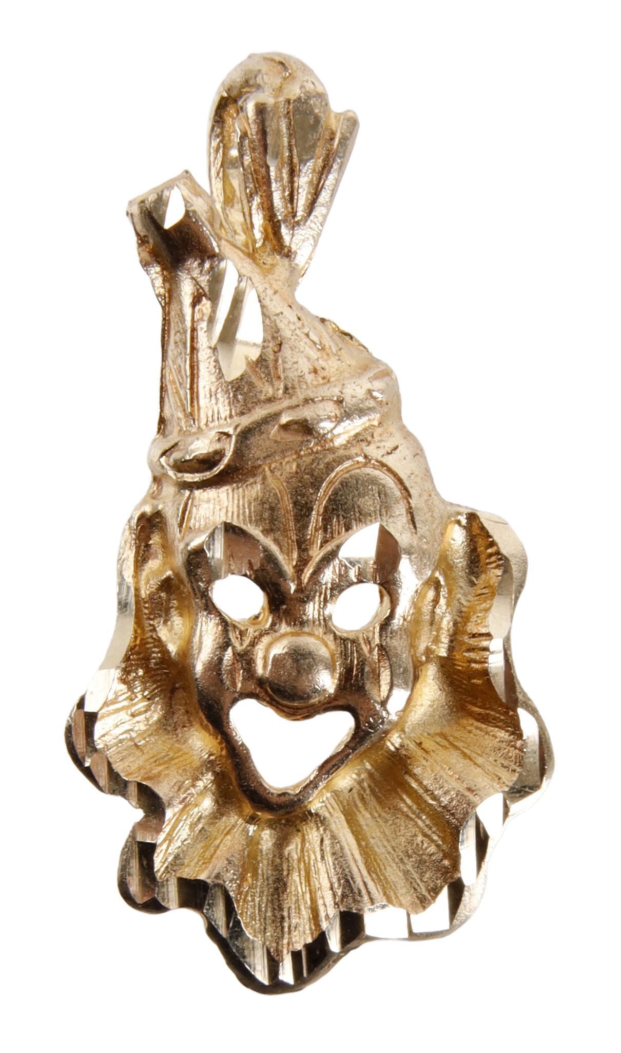 Clown Pendant 14K Yellow Gold: 14K yellow gold clown pendant with diamond cuts. Stamped "14K" on reverse. Measures 1x0.5 inches. | This lot has a reserve.
