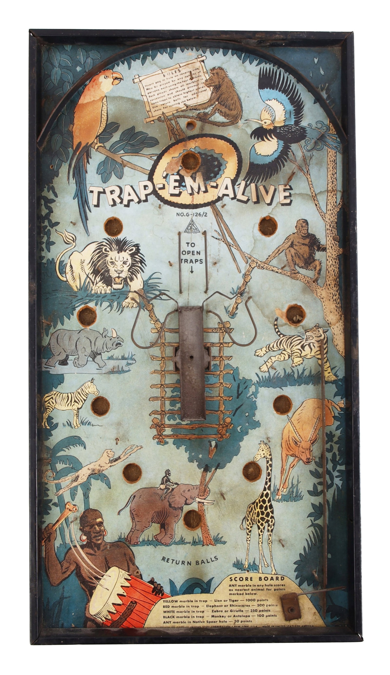 Trap-Em-Alive Tabletop Pinball Jungle Art: Early tabletop pinball game with safari theme called "Trap-Em-Alive." This unique pinball board is themed around wild African animals, and features both a native tribesman and a spear motif. Game rule