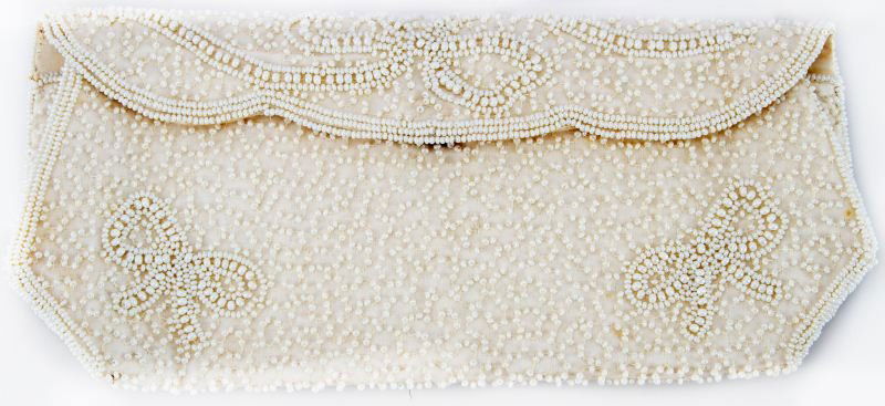 VINTAGE ANTIQUE HANDMADE BELGIUM BEADED HANDBAG: Ivory hand-beaded clutch. Made in Belgium. 10 inches in length and 4 inches in height, with original mirror slip-case. Excellent condition.