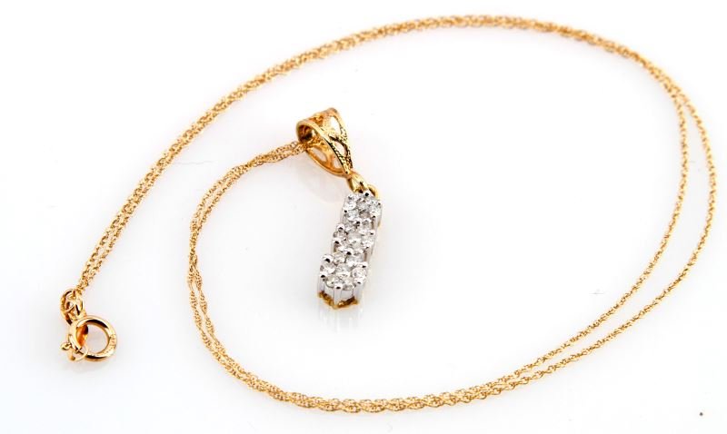 LADIES 14K YELLOW DIAMOND CLUSTER PENDANT: Three seven stone cluster gallery heads, slightly graduated in diameter, with the approximate total diamond weight of 21 round brilliant cut diamonds; .45ct, graded I/SI2. Fancy cut out bail on top of