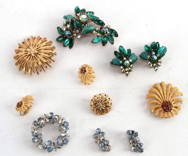 SMALL LOT VINTAGE COSTUME BROOCH & EARRING SET: Four complete sets; earrings and brooches, manufactured by Monet, Trafari, Beaujewels, and Judy Lee, estimating 1950's to mid 1960's. All in good shape.