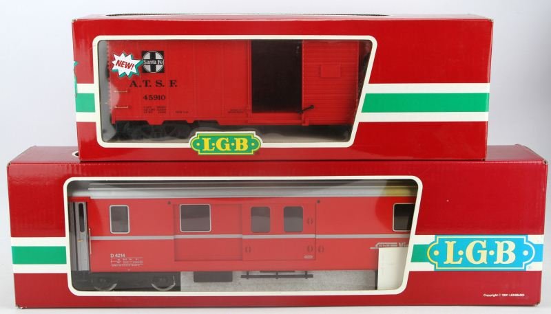 2 LGB QUEEN MARY SERIES SANTA FE BOXCAR TRAINS: 2 Lehmann, Gross, & Bahn Queen Mary Series red boxcar trains. Item numbers 45910, in original boxes. Made in Germany. Excellent condition.