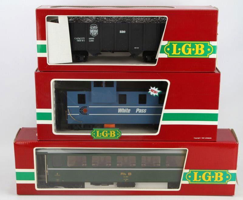 LOT OF 3 LGB THE BIG TRAIN CARS: Lehmann, Gross, & Bahn Trains. 1 item 4076 East Broad Top Hopper, 1 item 3069 Rhatische Bahn Baggage car, 1 item 4071 White Pass & Yukon Caboose. All in original boxes in excellent condition. Made in