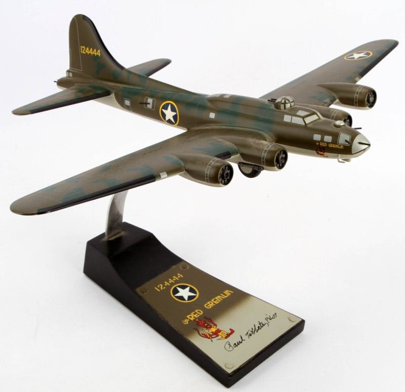 RED GREMLIN B-17 BOBER MODEL NUMBER 7: Model plane measures approximately 15 inches in length and comes with it's original display stand. Some minor scratches; overall in very good condition. This lot has a reserve.