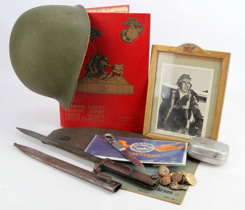 M-1 USMC BAYONET & MORE MILITARY COLLECTABLE LOT: Includes post-War M-1 helmet liner, 16 WWI U.S. Army uniform buttons, 1914 U.S. Army aluminum soap dish container, Night Vision for Airmen instructional 1944 booklet, wings atop frame photo of WWII ai