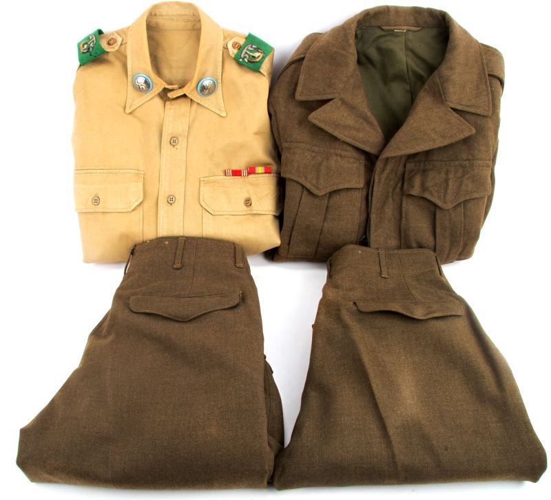 US WWII 1ST CAVALRY 7TH REG UNIFORM AND IKE JACKET: Staff SargentÕs uniform with shirt, tunic, and two pairs of trousers. First 1st Cavalry patch, 7th Regiment custom insignia, blue plastic backed cavalry collar tabs, ribbon bars for Good Conduct and 