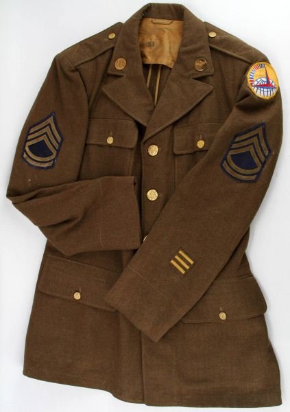USAAF TECHNICAL SERGEANT AIR FERRY COMMAND JACKET: Jacket is made by De Luxe Clothing MFG. Co and is a size 38R. Buttons are made by Waterbury Button Co. Ranking on the jacket is Technical Sergeant, and has wings pin on the collar tab. Overall Jacket 