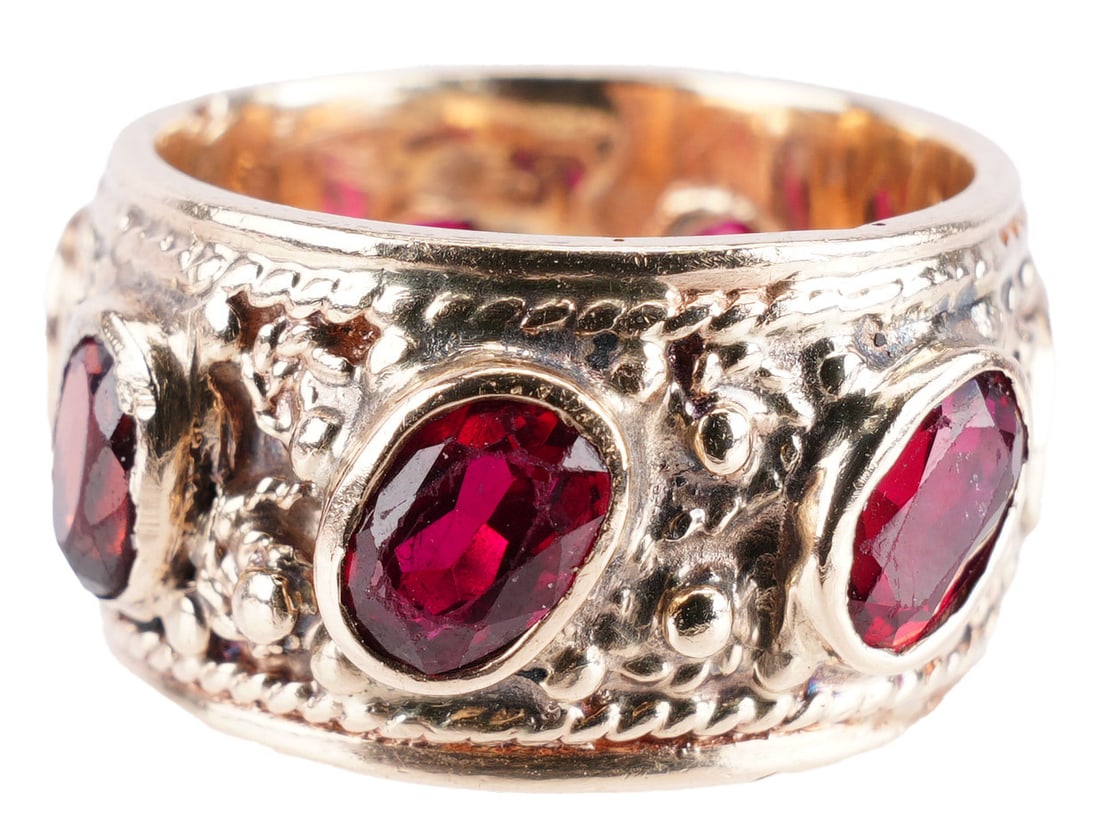 Garnet Antique Band Ring 14K Yellow Gold: Size 6 ring featuring 7 oval cut garnet stones measuring 5.7x3.7 millimeters. Band measures 11 millimeters wide. Total weight 9.48 grams, This lot has a reserve.