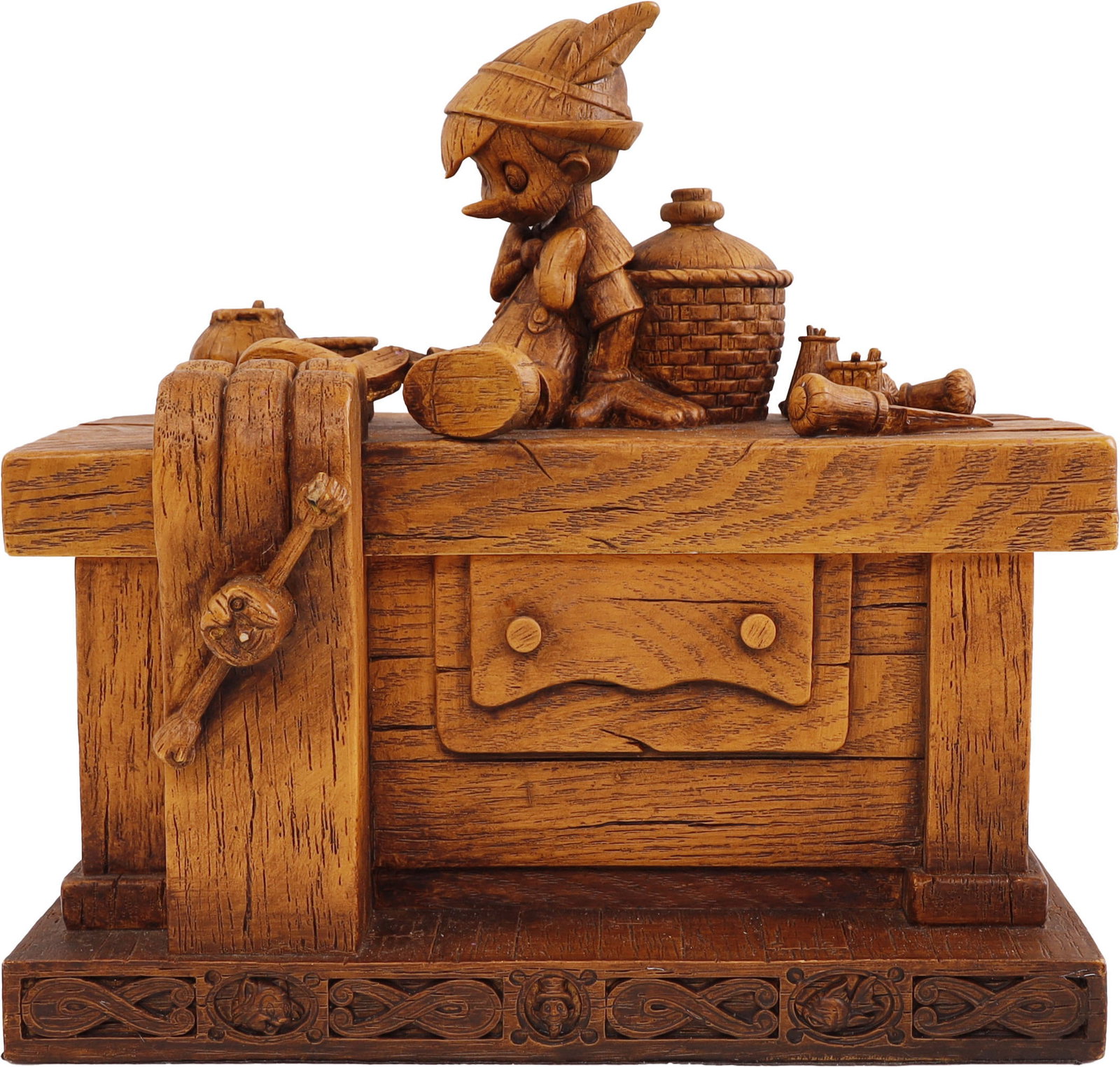 Robert Olszewski Pinocchio on Workbench Box: A resin box from the Disney Heirloom Boxes collection by Robert Olszewski. The piece depicts Pinocchio on Geppetto's workbench, which acts as a lid for the box. The base features portraits of Jiminy