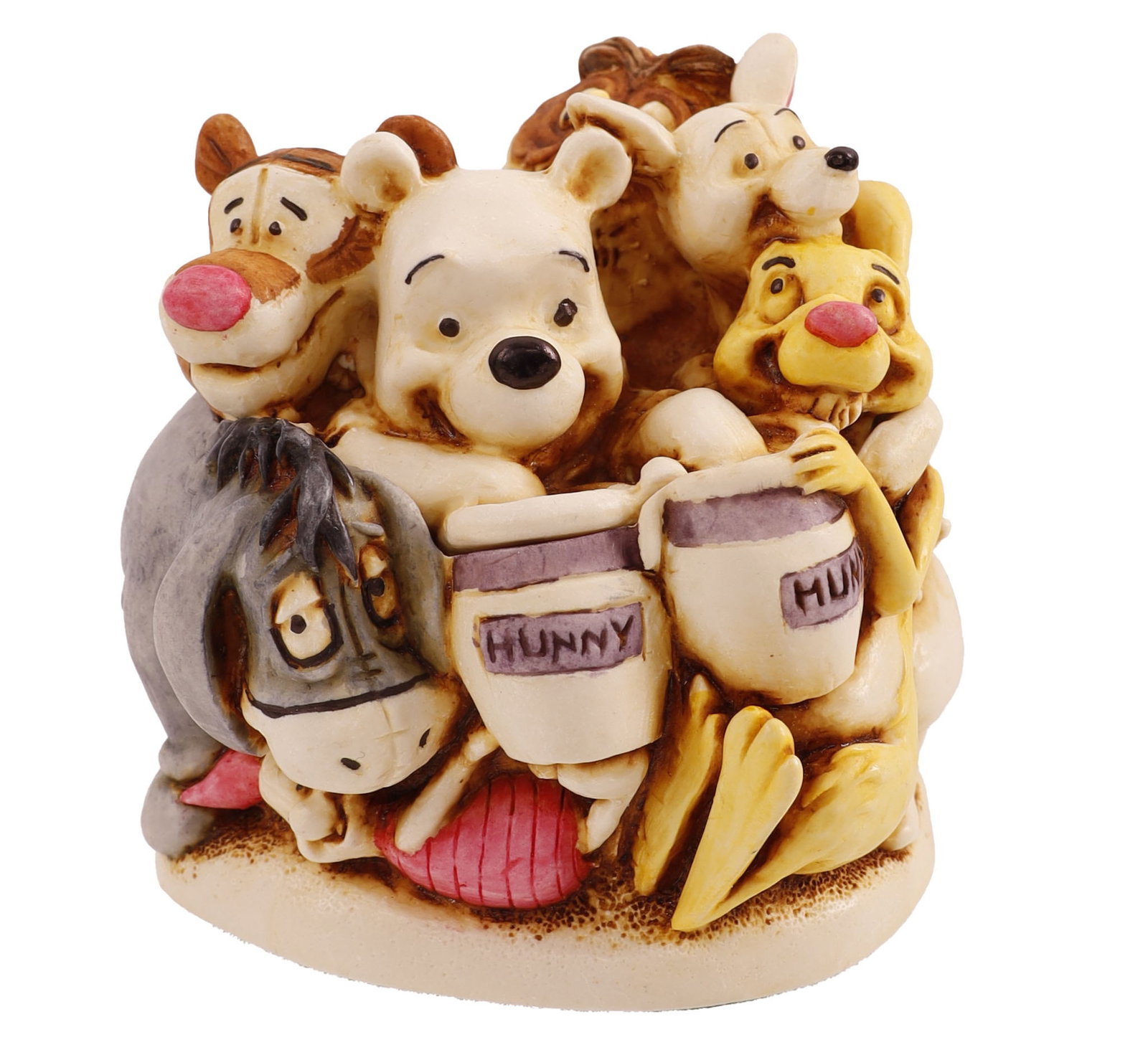 Winnie the Pooh Bear and Friends Harmony Kingdom: A resin box figurine titled 'Pooh and Friends' by Harmony Kingdom. The piece features Winnie the Pooh, Piglet, Tigger, and Eeyore. It belongs to the Disney collection. This lot has a reserve.