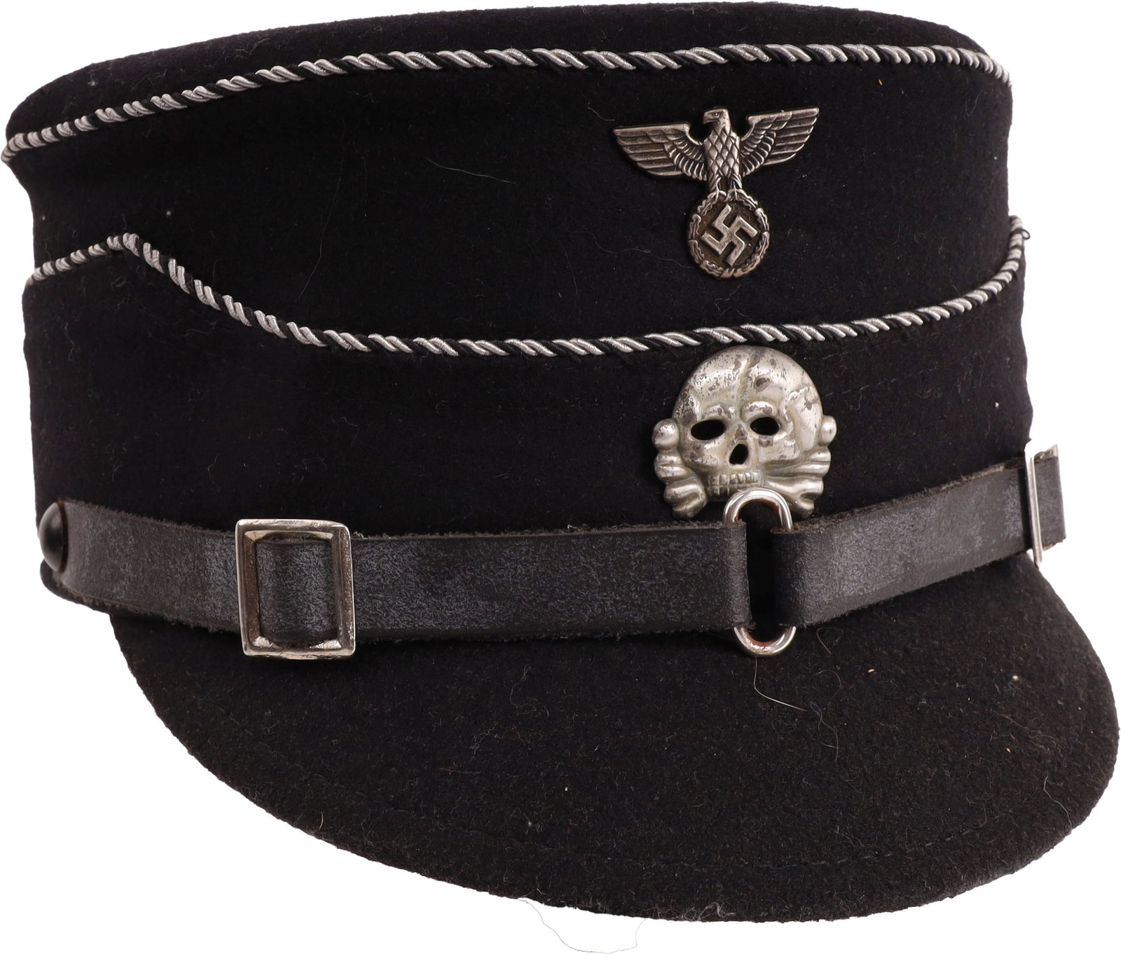 WWII Allgemeine SS Kepi Cap German Third Reich: Black wool cap with alternating black and aluminum wire piping. Features early Reichsadler and totenkopf pins. Leather chin strap. Brown leather sweatband and simulated silk liner. Size 60 stamped