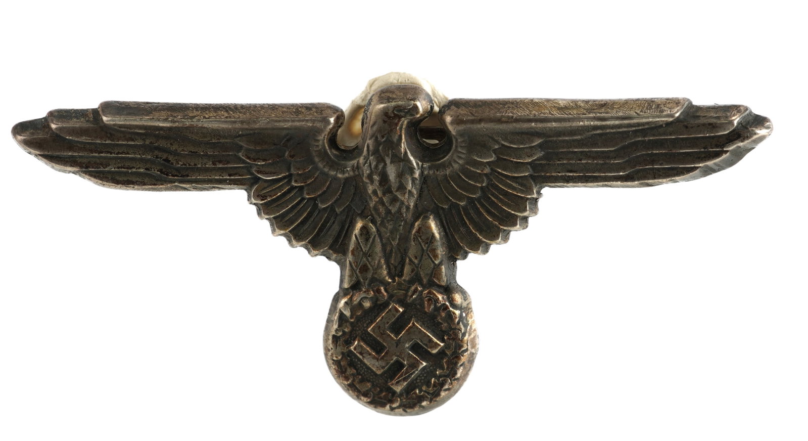 WWII Allgemeine SS Visor Eagle Pin German Reich: Silvered tombac Eagle measuring 2 5/8 inches. Reverse marked SS 360/42 RZM. This lot has a reserve.