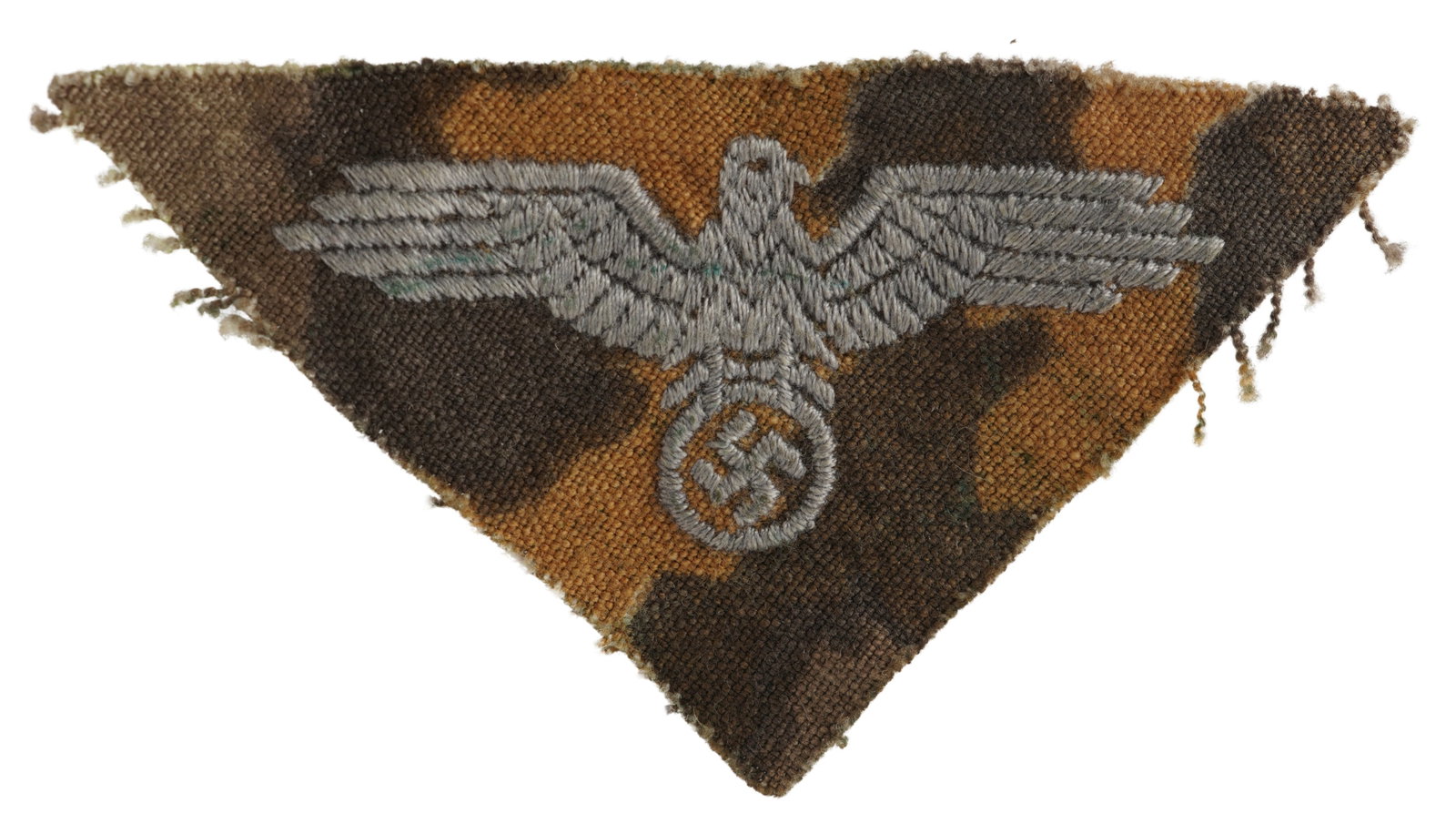 WWII German SS Reversible Camo Patch: SS reversible camo cut patch with embroidered eagle. Measures 3 inches. Non-fluorescing. This lot has a reserve.
