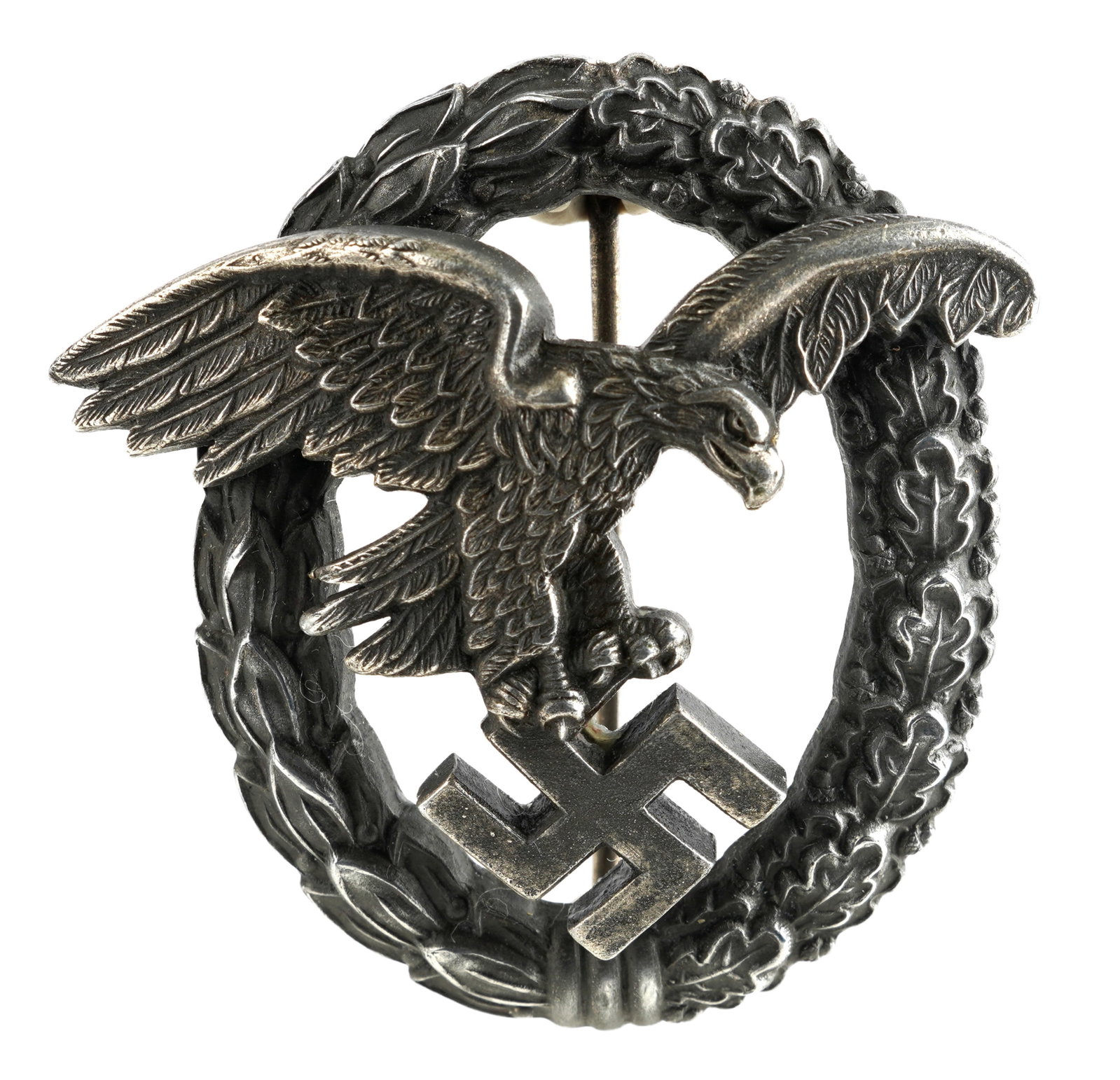 WWII Luftwaffe Observer Badge Assmann: WWII German Luftwaffe Observer Badge Assmann Luftwaffe eagle riveted to oak and Laurel leaf wreath. Measures 2 inches. This lot has a reserve.