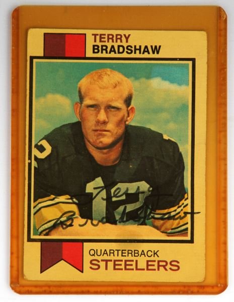 AUTOGRAPHED 1973 TERRY BRADSHAW FOOTBALL CARD: This is a 1973 Topps #15 card signed right across the chest. Overall in good condition.