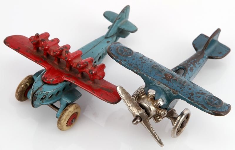 TWO VINTAGE 1930'S AIRCRAFT CAST IRON TOY PLANES: One UX 99 cast-iron blue, single-engine plane measuring 4.5 inches long with a wingspan of 3.75 inches marked with a 3 under one of the wings, good to very good condition. One DO X Flying Boat cast-ir