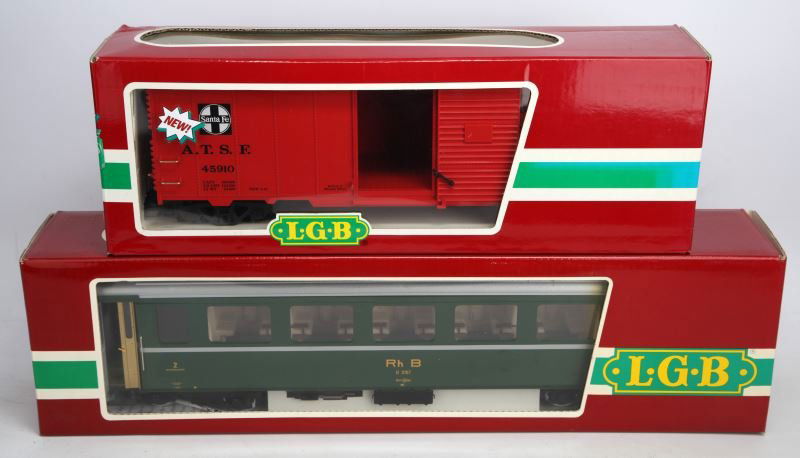 LOT OF 2 LGB TRAINS: 1 Lehman, Gross, Bahn Nichtraucher green passenger coach train. Item number 3167. 1 Lehman, Gross, Bahn Red Santa Fe train item 45910. Made in Germany, in original box. In excellent condition.
