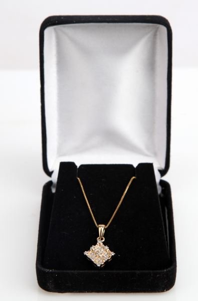 LADIES 14K YELLOW DIAMOND FASHION PENDANT: Measuring 10 x 10mm, this unique "woven" design pendant setting contains nine round full cut diamonds each weighing approximately .02ct., sixteen square princess cut diamonds, each weighing approximat