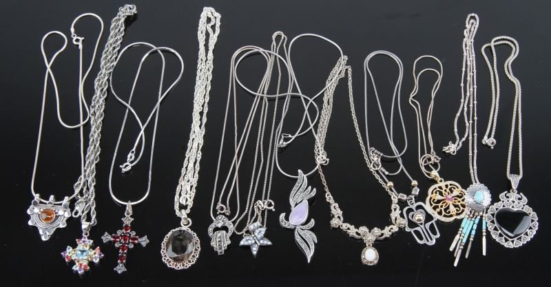SMALL LOT LADIES STERLING PENDANTS: Twelve pieces total, various stones including; lavender jade, garnet, amber, smoky quartz, black onyx, ruby, turquoise, citrine, blue topaz, peridot and amethyst. All include sterling chains.
