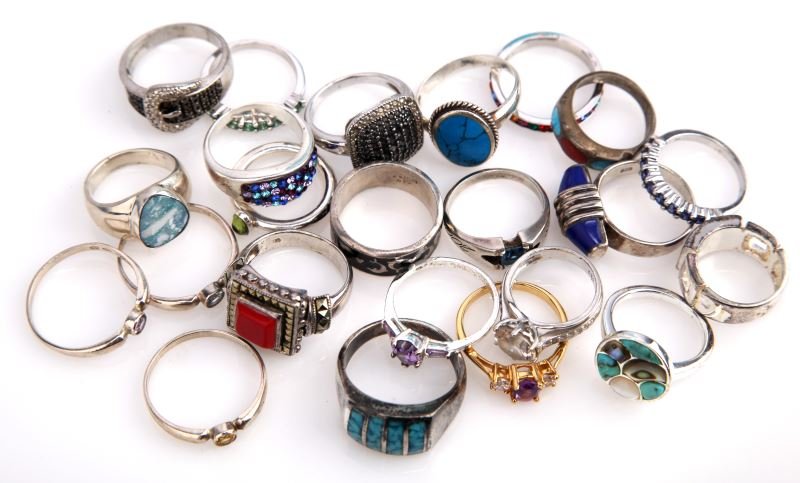 SMALL LOT LADIES STERLING FASHION RINGS: A total of 23 rings in all; some enameling work, some inlay. Stones including; boulder opal, turquoise, red coral, marcasite, carbonado, bus topaz, amethyst, citrine.