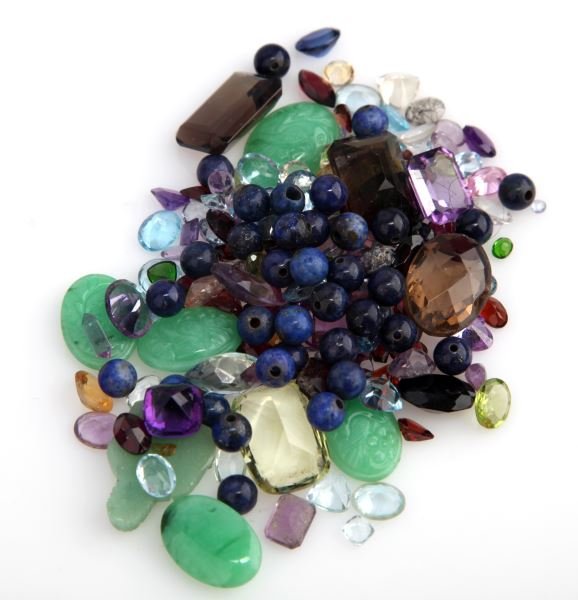 DEALERS LOT 288.11CT T.W. SEMI-PRECIOUS GEMSTONES: Nice assortment of gems, including Lapis lazuli beads, Smoky quartz, Moz garnets, green tourmaline, peridot, amethyst, various shades of blue topaz, aquamarine, Jadite jade cabochons and citrine.