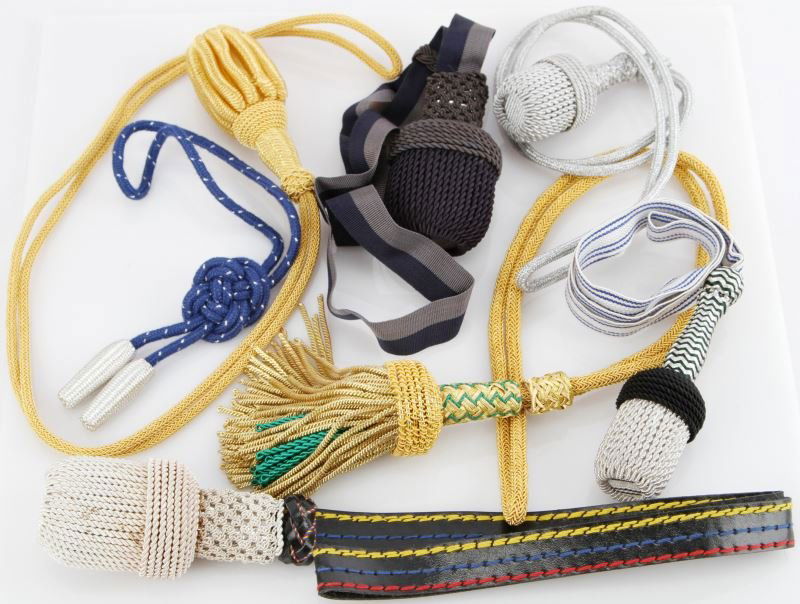 7 VARIOUS POST WAR EDGE WEAPON PORTAPEES: Seven post-War made portepees and accoutrements for German edged weapons. All in as new condition.